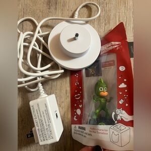 Green Audio Character with White Charging Base